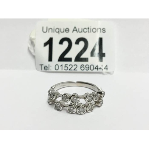 1224 - An 18ct white gold 2 bar ring of spaced diamonds