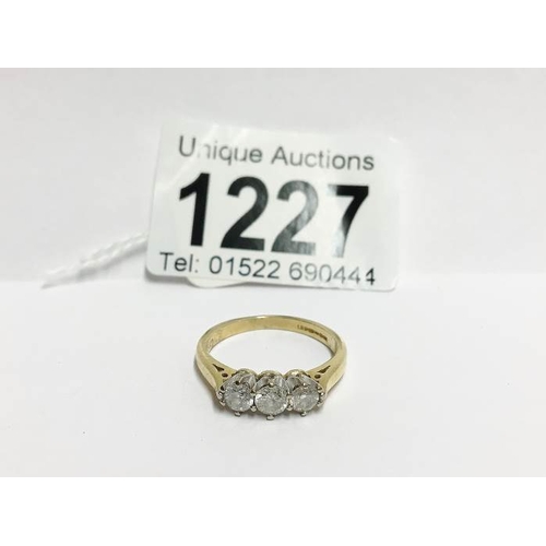 1227 - A 3 stone yellow gold half carat diamond ring, size O