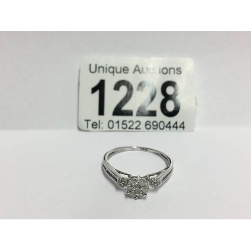 1228 - An 18ct white gold floral diamond ring with diamond shanks, size S