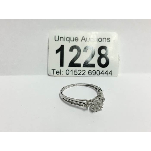 1228 - An 18ct white gold floral diamond ring with diamond shanks, size S