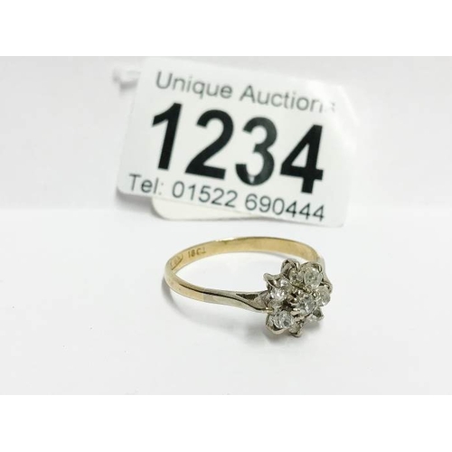 1234 - An 18ct gold floral 55pr diamond ring, size Y