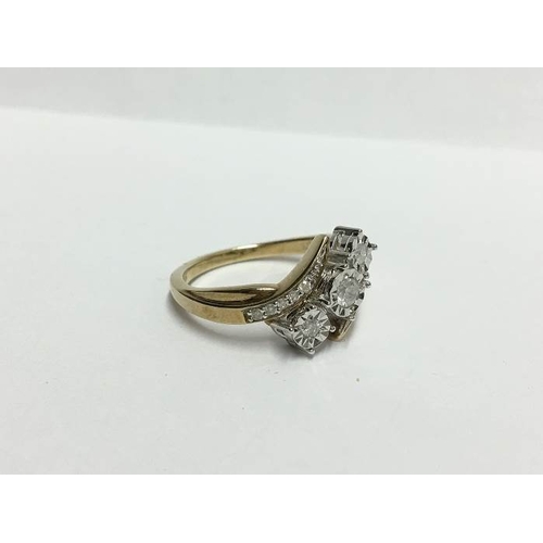 1235 - A yellow gold floral diamond crossover ring, size S