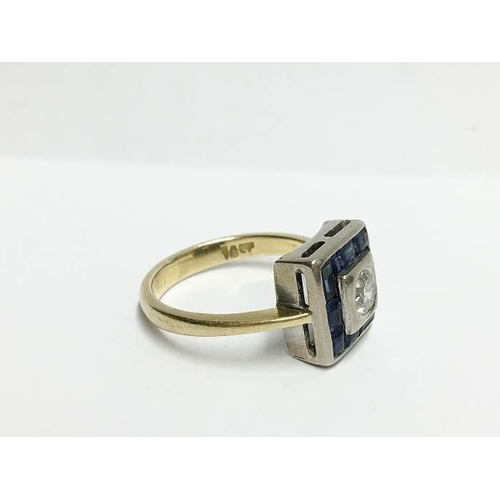 1243 - An 18ct yellow gold square shaped ring with centre 35pt diamond surrounded by sapphires, size U