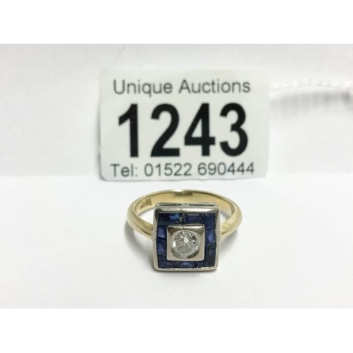 1243 - An 18ct yellow gold square shaped ring with centre 35pt diamond surrounded by sapphires, size U