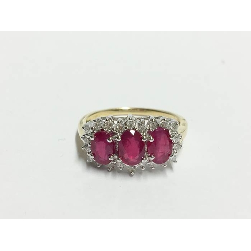 1244 - An 18ct yellow gold ring set ruby and diamonds, size T