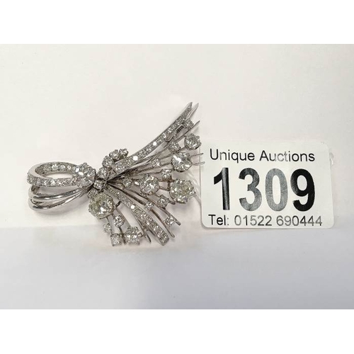 1309 - A superb diamond brooch in the form of a corsage