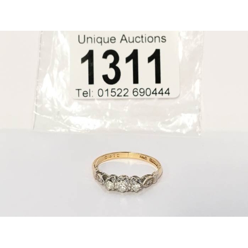 1311 - An 18ct gold and platinum ring set 3 diamonds