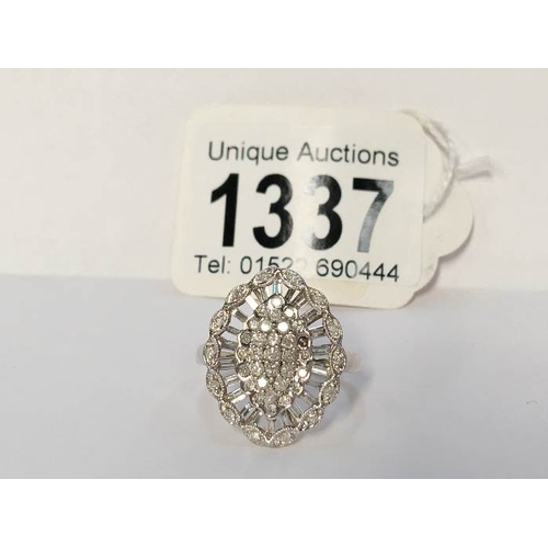 1337 - A 9ct white gold ring set diamonds (one stone missing)