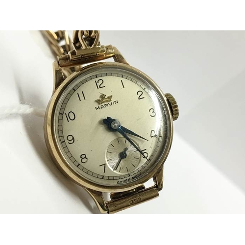 1397 - A Marvin ladies watch with twisted gold strap, all gold cased and in working order, 19.8gms