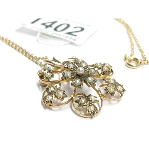 1402 - An Edwardian 9ct gold seed pearl pendant