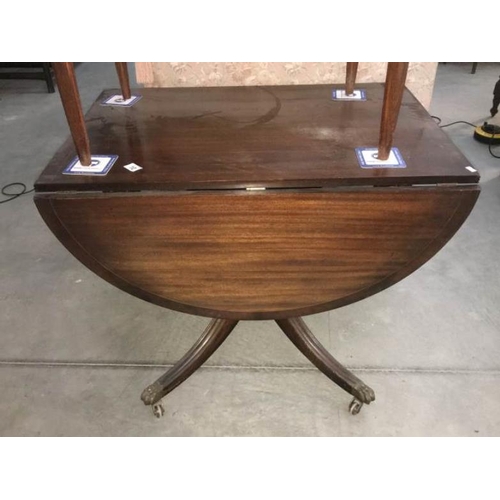 10 - A drop leaf mahogany tea table