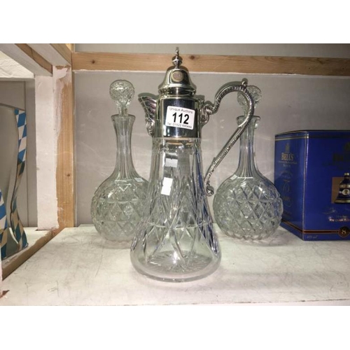 112 - A pair of cut glass decanters etc