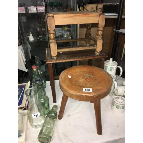 128 - 2 old wooden stools and a wooden table