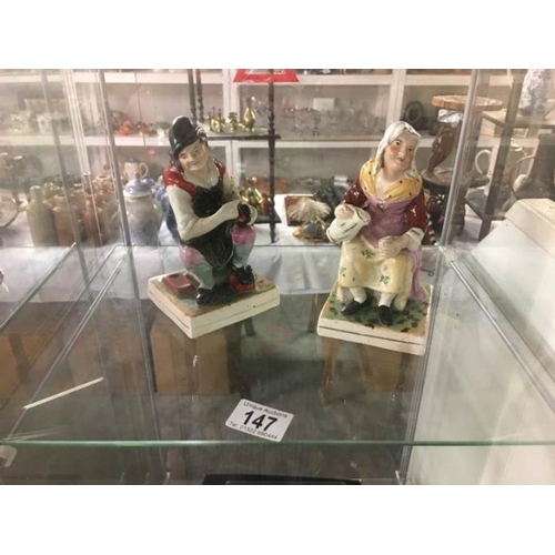 147 - A pair of 19th c Staffordshire figure Cobbler Johnson and wife Nell