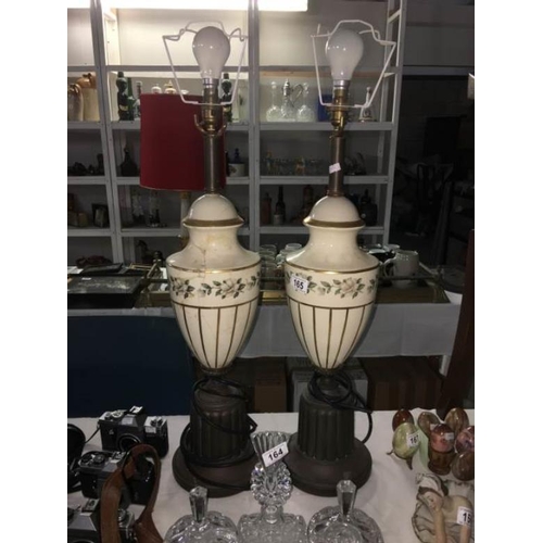 165 - A pair of ornate porcelain and speleter table lamps (1 a/f)