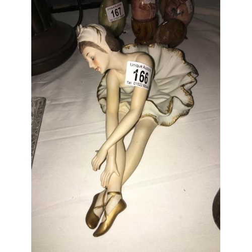 166 - A bisque figurine of a ballet dancer