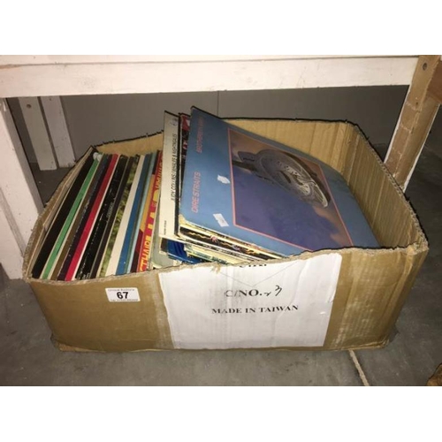 67 - A quantity of LP records including Dire Straits, Meatloaf etc