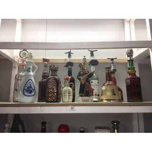 77 - A quantity of bottles of alcohols including novelty and Bells whicky bells and optics