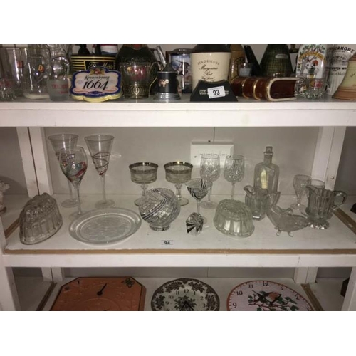 94 - A quantity of glassware including paperweights, jelly moulds etc