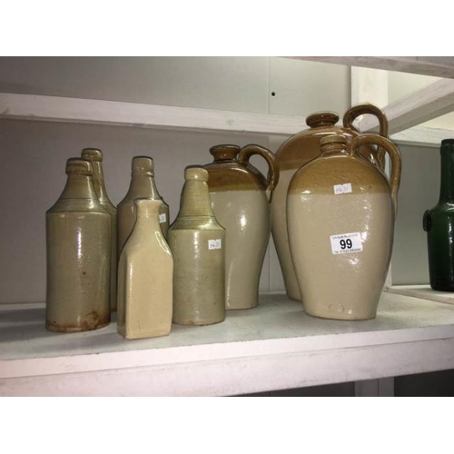 99 - A quantity of stoneware beer bottles and flagons