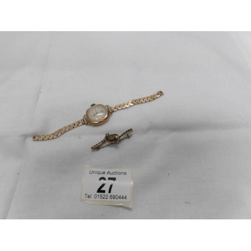 27 - A 9ctg gold brooch and an Avia 9ct gold ladies wrist watch