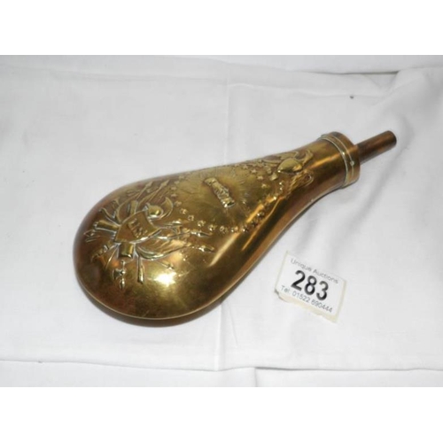 283 - A brass gun powder flask