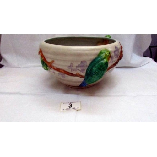 3 - A Clarice Cliff bowl decorated with parrots in relief and marked Clarice Cliff, Newport Pottery.