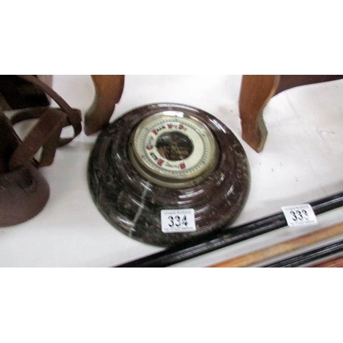 334 - A super red Cornish Serpentine barometer with porcelain face, 23cm diameter