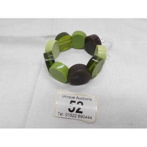 52 - A bakelite bracelet in green tones