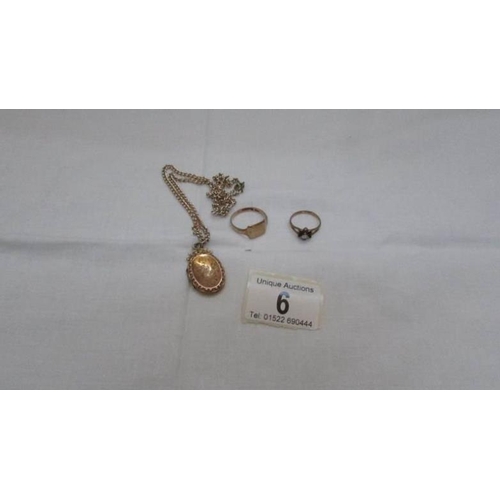 6 - 2 9ct gold rings and a 9ct gold locket on a yellow metal chain