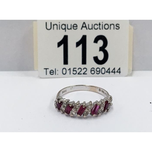 113 - A 14ct yellow gold ruby and diamond ring (baguettes and brilliants)