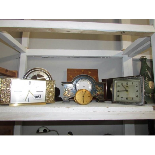 1057 - 7 assorted mantel clocks (one shelf)