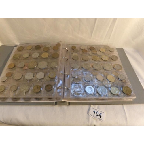 104 - A collection of in excess of 450 world coins in an album