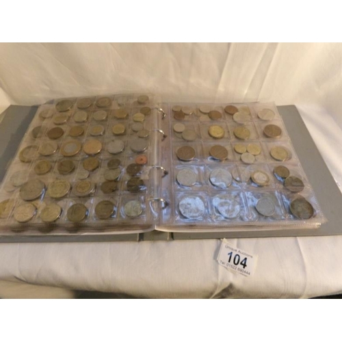 104 - A collection of in excess of 450 world coins in an album