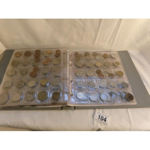 104 - A collection of in excess of 450 world coins in an album