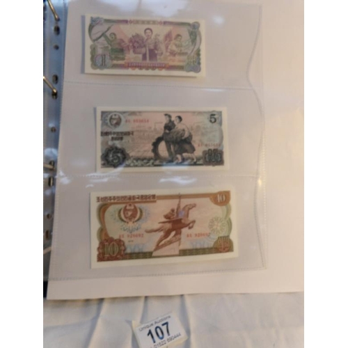 107 - An album of approximately 20 uncirculated and high quality bank notes