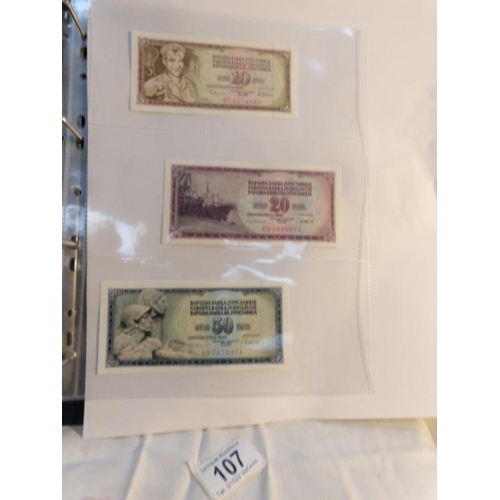 107 - An album of approximately 20 uncirculated and high quality bank notes