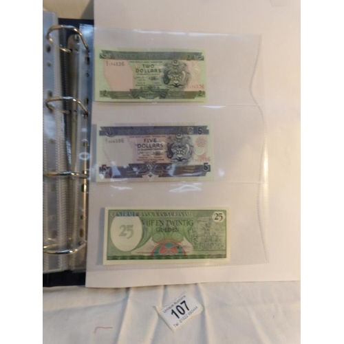 107 - An album of approximately 20 uncirculated and high quality bank notes