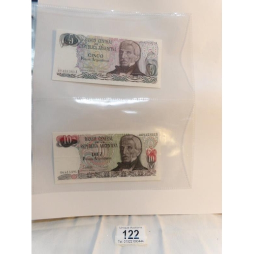 122 - An album of approximately 60 uncirculated and high quality world bank notes