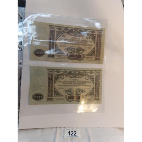 122 - An album of approximately 60 uncirculated and high quality world bank notes