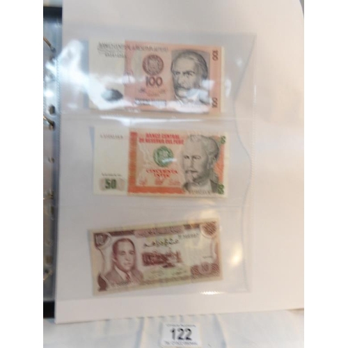 122 - An album of approximately 60 uncirculated and high quality world bank notes