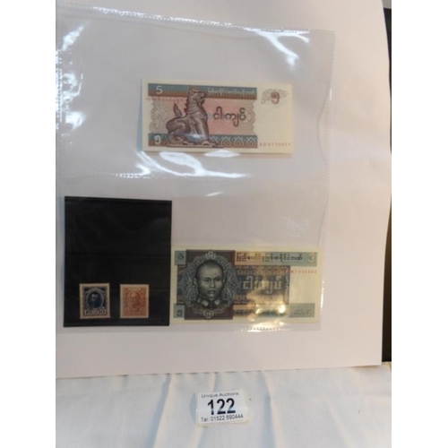 122 - An album of approximately 60 uncirculated and high quality world bank notes