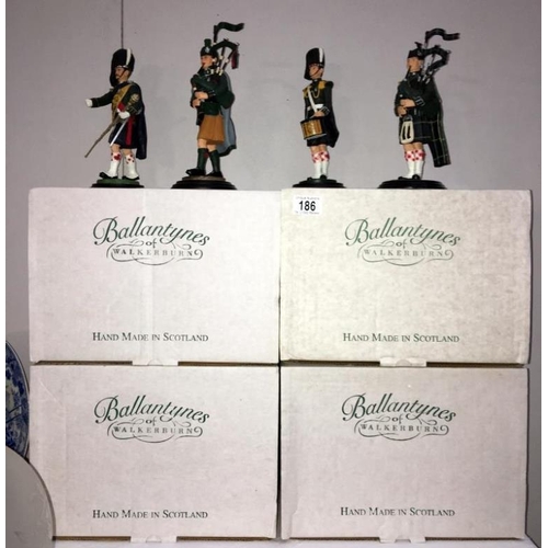 186 - 4 boxed Scottish Piper figures