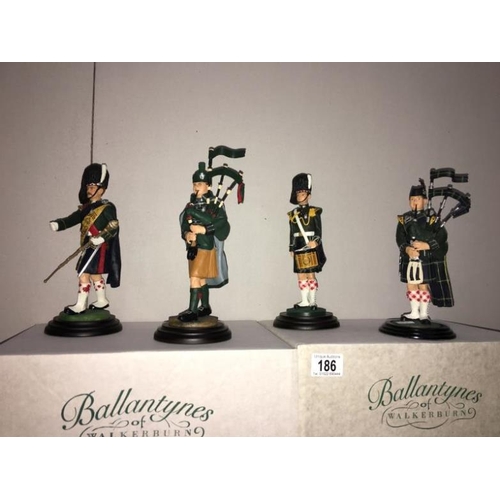 186 - 4 boxed Scottish Piper figures