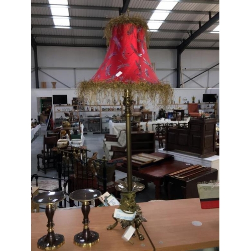 238 - A brass based table lamp, a pair of candle stands and a small copper coal helmet