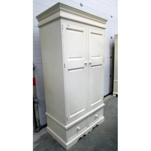 522 - A painted wardrobe with drawer base