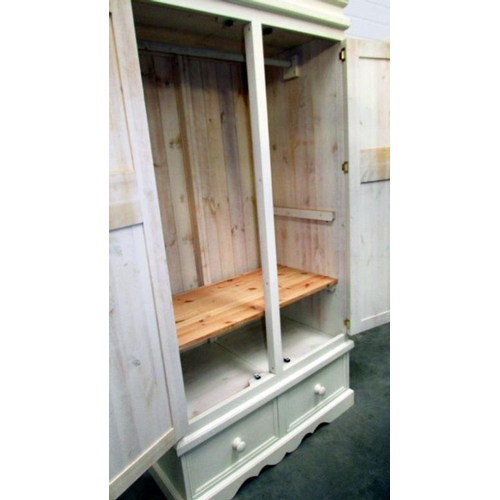 522 - A painted wardrobe with drawer base