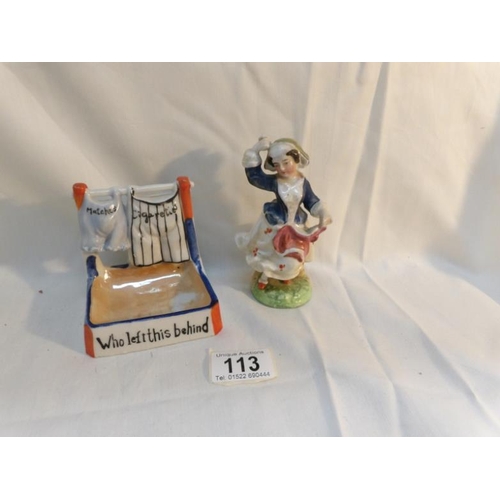 113 - A vintage novelty match striker and a Victorian figure