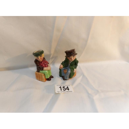 154 - 2 miniature hand painted Toby jugs being Oliver Twist and The Artful Dodger