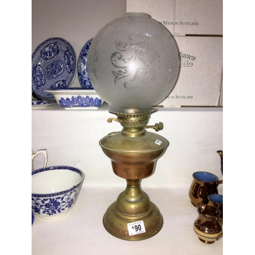 190 - A brass oil lamp with etched shade (missing chimney)